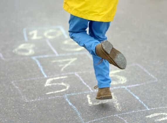 Boy doing hopscotch